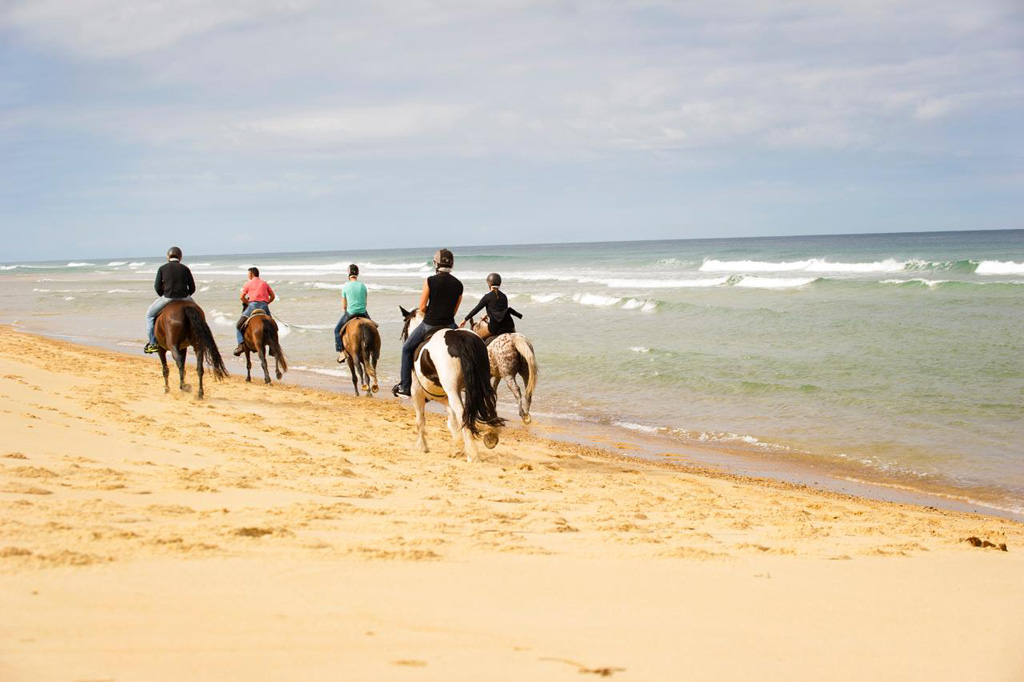Riding on the beach